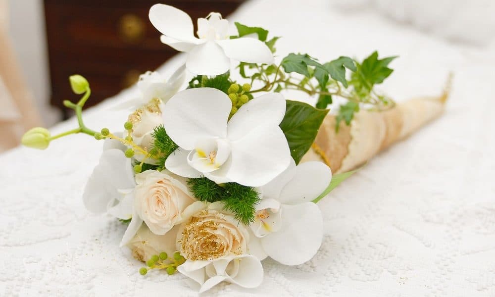 Cream and white artificial floral bouquet.
