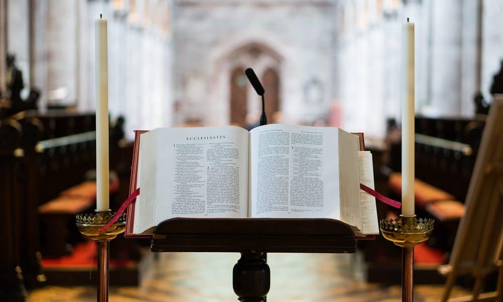 A bible on a wooden lectern facing the congregation.