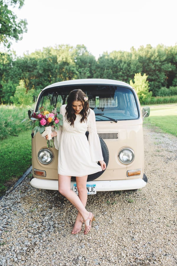 Bride outside wedding campervan