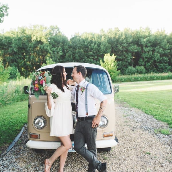 Married couple outside campervan