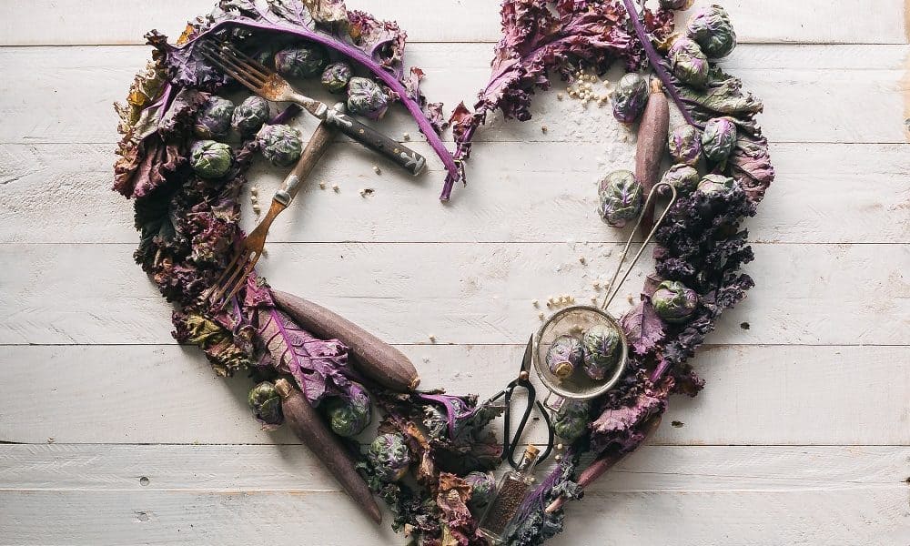 A love heart made of purple dried flowers