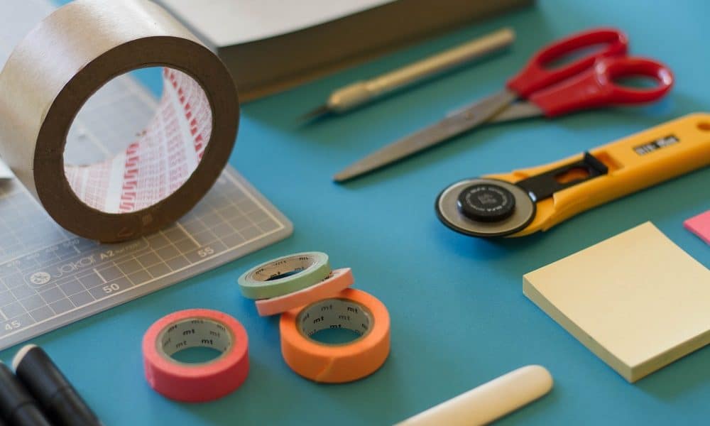 A crafts station full of brightly colored tools and materials.