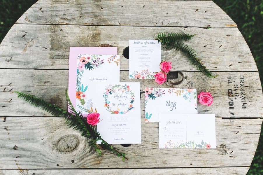 Colorful invites on a wooden table