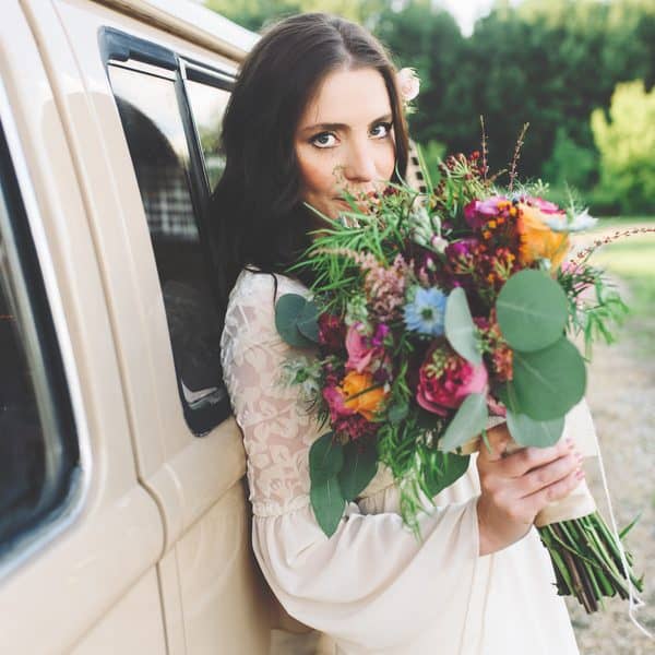 Modern bride with colorful bouquet.