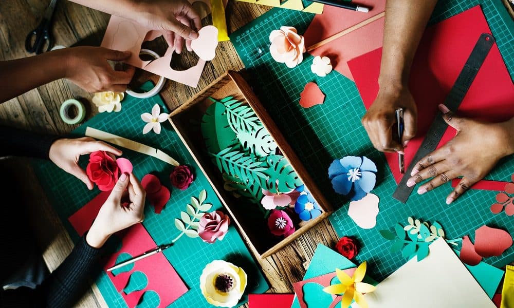 Brightly colored paper crafts, tools, and materials.