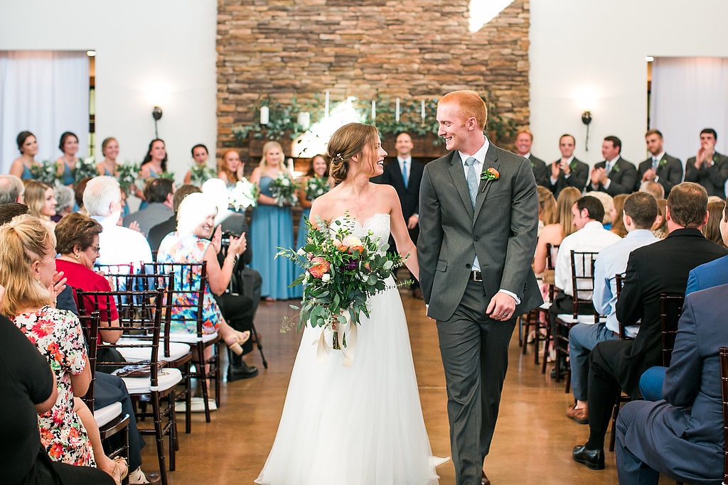walking down the aisle hand in hand